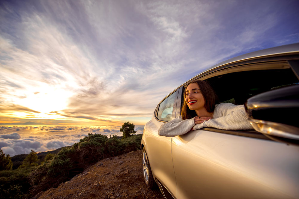 Woman In a Car | Featured Image for the Sell My Car Page of Tough Automotive